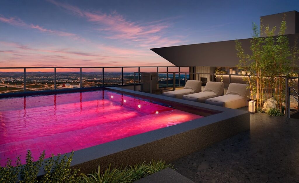 Piscinas coloridas transformam áreas de lazer em experiências de arquitetura em Goiânia Perspectiva da Pink Pool no Ryokan Flamboyant (Créditos - Divulgação Sousa Andrade Construtora)